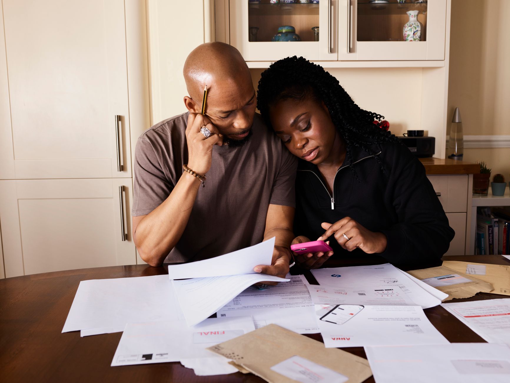 Financial calculations, calculator and euro bills indicating property transaction taxes in Spain