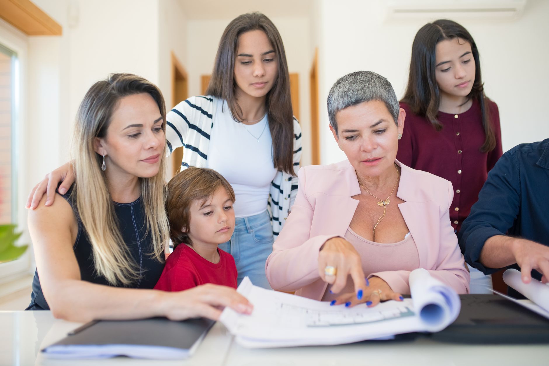 American family reviewing a Spanish property purchase with a mortgage specialist